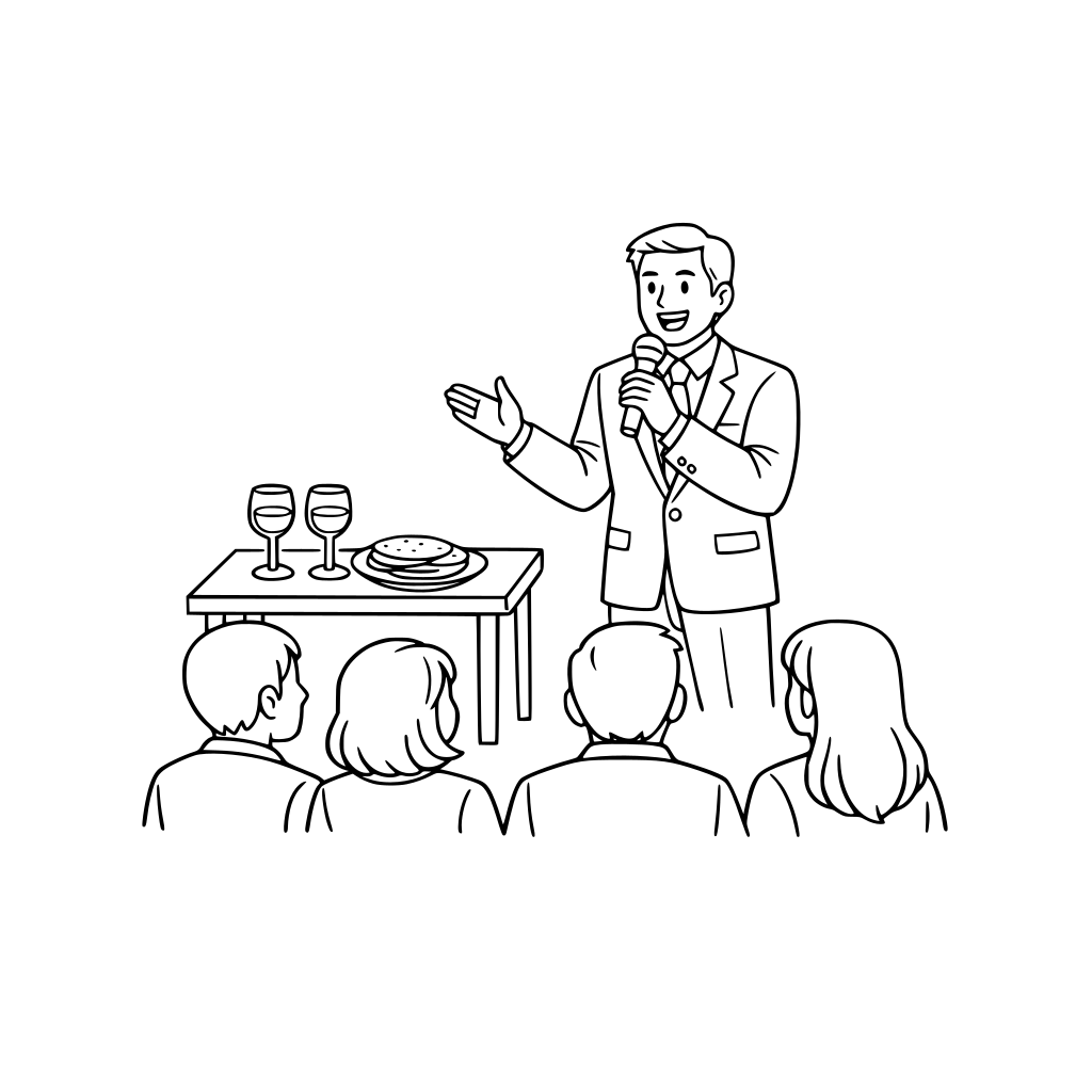 Un hombre vestido de traje dando un discurso junto a él una mesa con dos copas de vino y un plato con unas tortillas, frente al hombre varias personas sentadas viéndolo con atención